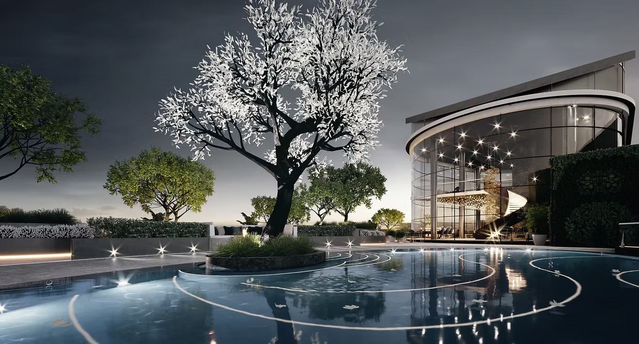 Landscaped pool courtyard with a sculpted tree, lit at dusk